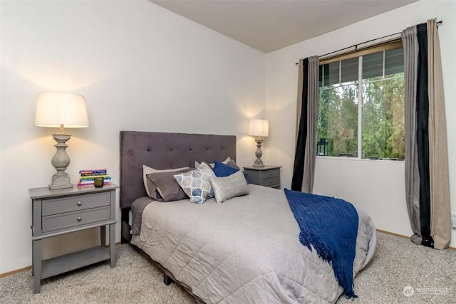 bedroom featuring light colored carpet