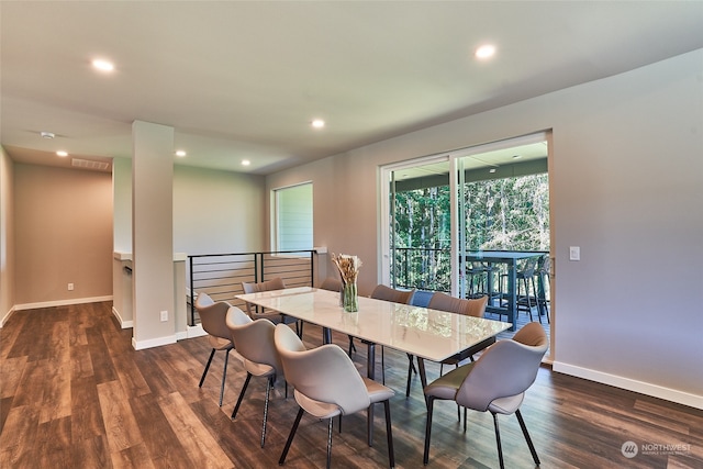 dining area with dark hardwood / wood-style floors