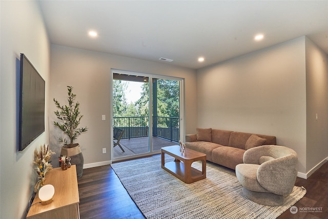 living room with dark hardwood / wood-style flooring