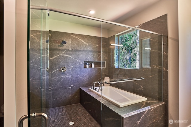 bathroom featuring separate shower and tub