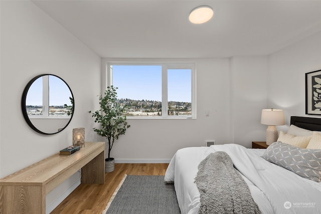 bedroom with light hardwood / wood-style flooring