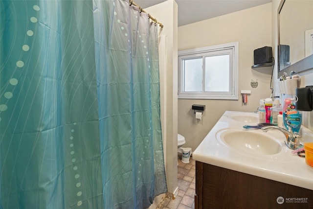 bathroom with vanity and toilet