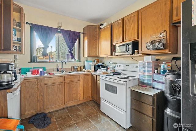 kitchen with white electric range and sink