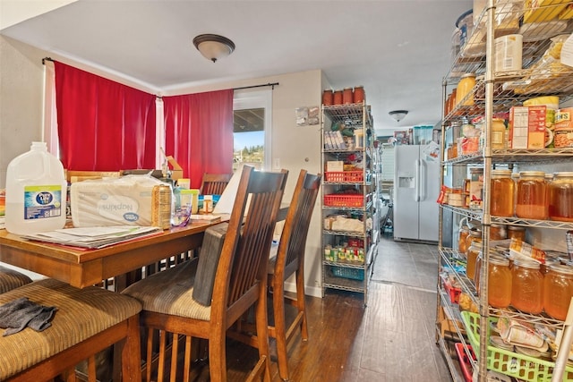 dining space featuring dark wood-type flooring