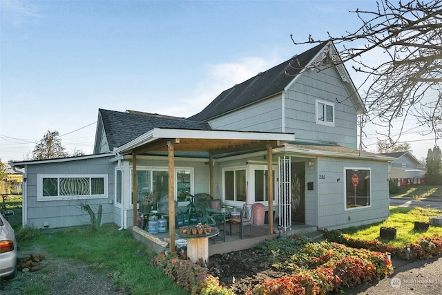 rear view of house with a porch