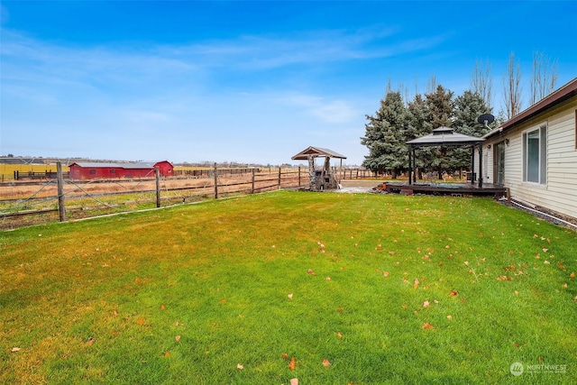 view of yard with a gazebo and a rural view