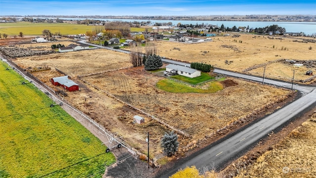 aerial view with a water view and a rural view