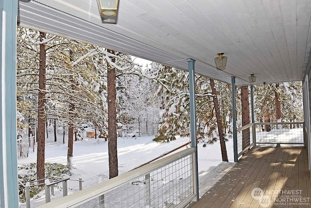 view of snow covered deck