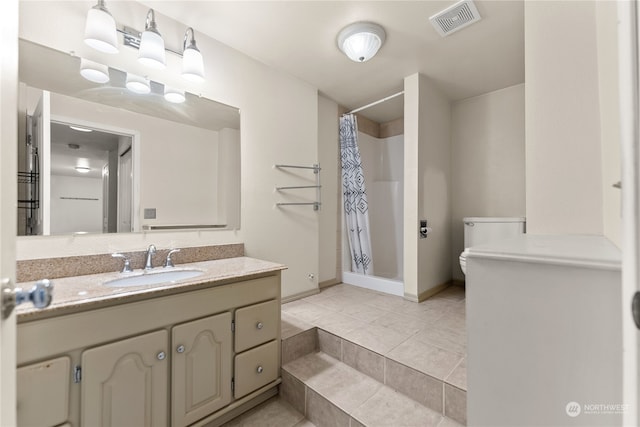 bathroom featuring tile patterned floors, vanity, toilet, and a shower with shower curtain