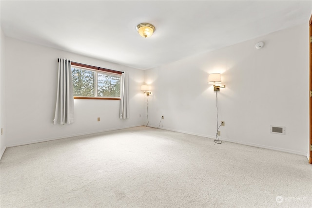 unfurnished room with carpet flooring