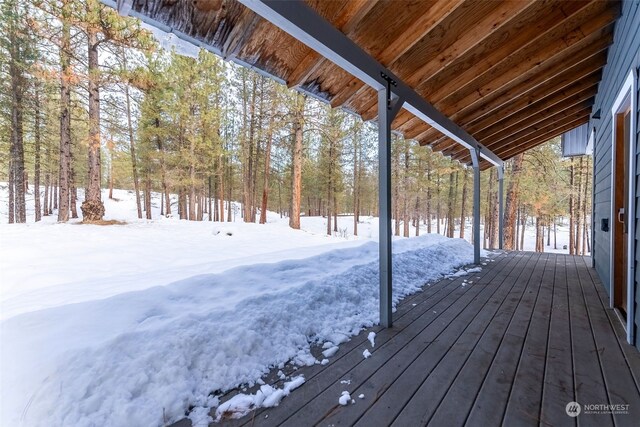 view of snow covered deck