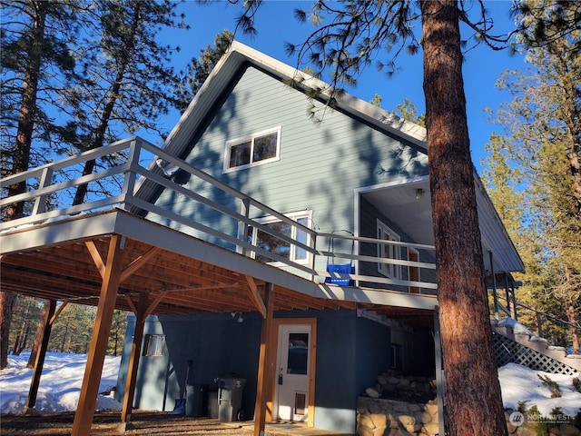 5 Chase Rd N, Winthrop, WA 98862 - back of property with a wooden deck and stairway