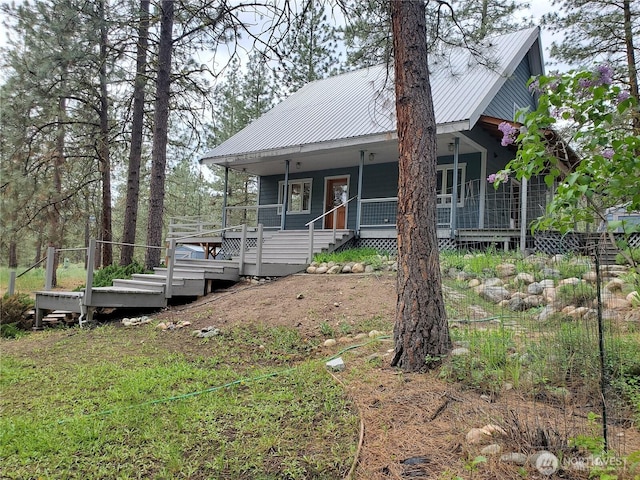 5 Chase Rd N, Winthrop, WA 98862 - view of front of house featuring metal roof and covered porch