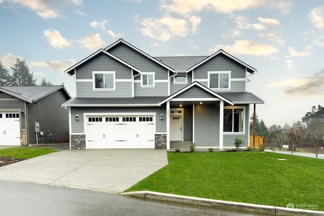 2605 43rd Ln SE, Olympia, WA 98501 - craftsman inspired home with driveway, a front lawn, stone siding, and an attached garage