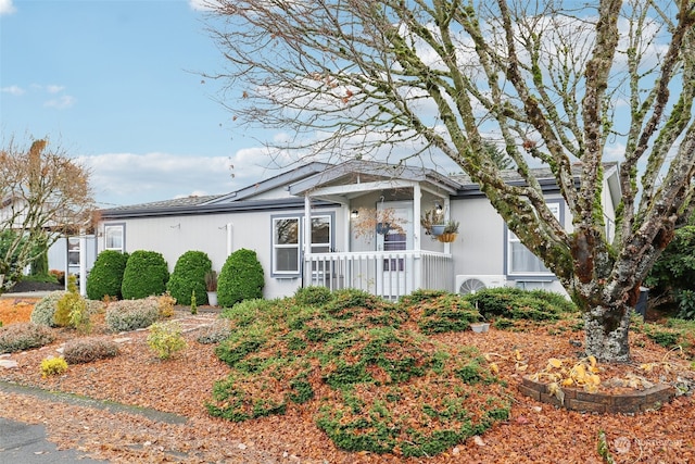 ranch-style house featuring ac unit