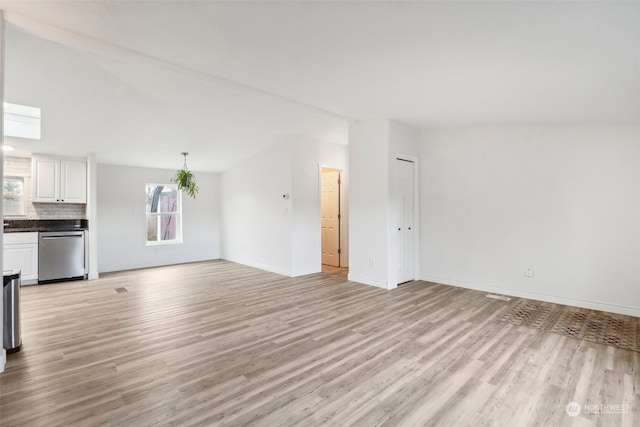 unfurnished living room featuring light hardwood / wood-style floors