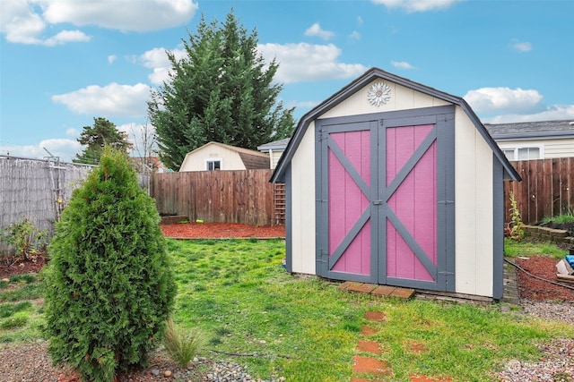 view of outbuilding with a yard