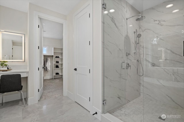 bathroom with a shower with door