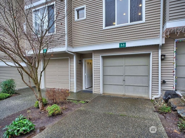 doorway to property featuring a garage