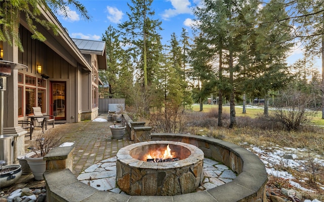 view of patio featuring an outdoor fire pit