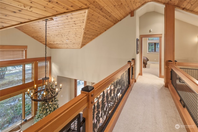 hallway with plenty of natural light and wooden ceiling