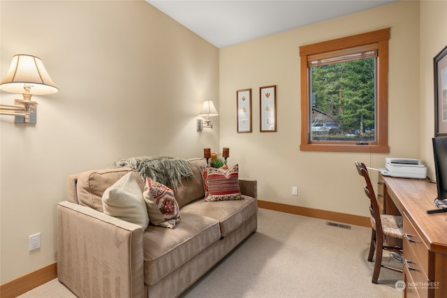 office area featuring light carpet, baseboards, and visible vents