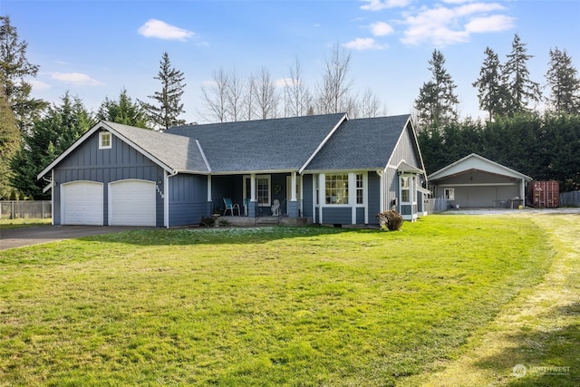 ranch-style home featuring a front lawn, a porch, and a garage