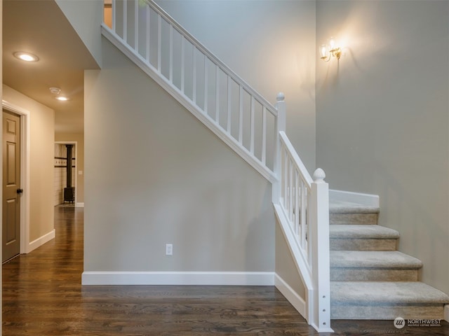 staircase featuring hardwood / wood-style flooring