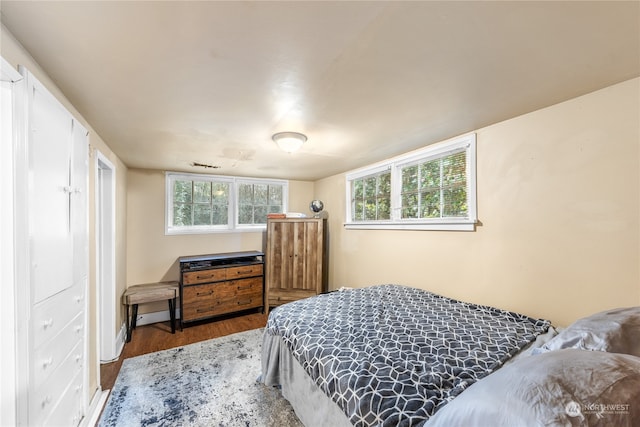 bedroom with hardwood / wood-style floors