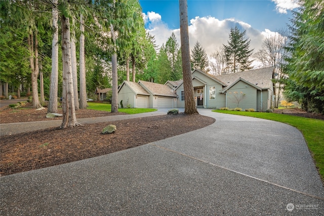 ranch-style home featuring a garage