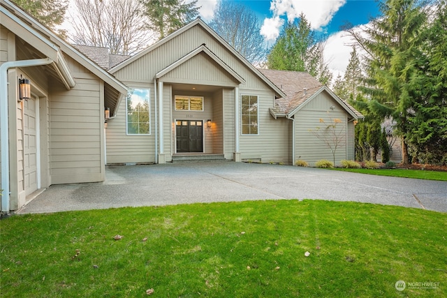 property entrance with a lawn