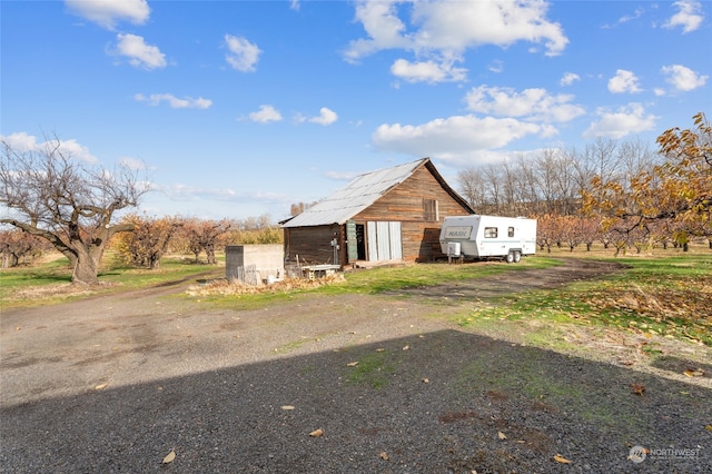 exterior space with an outbuilding