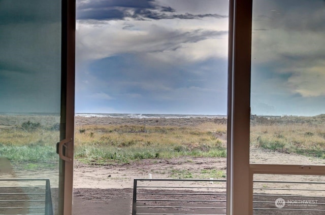 doorway to outside featuring a rural view