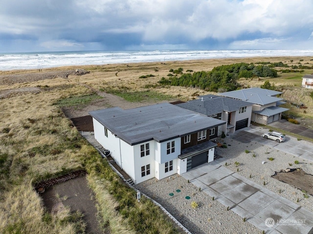 aerial view featuring a view of the beach and a water view