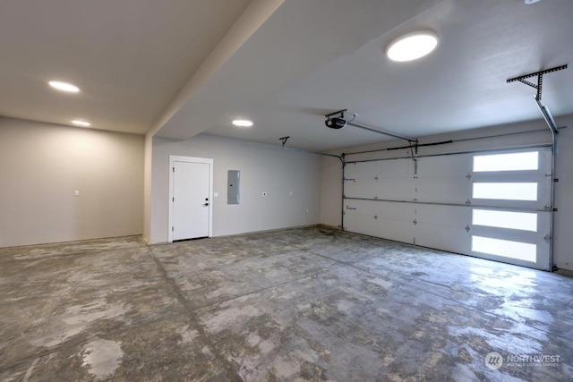 garage with electric panel and a garage door opener