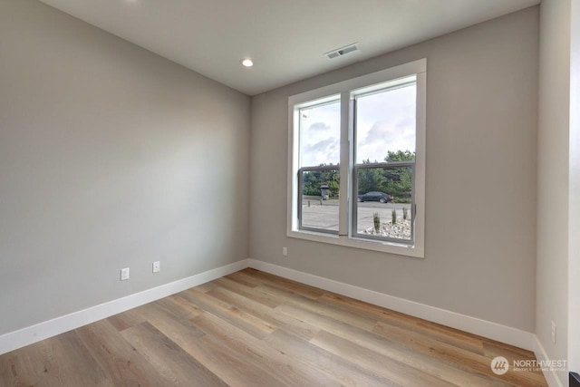 empty room featuring light hardwood / wood-style floors