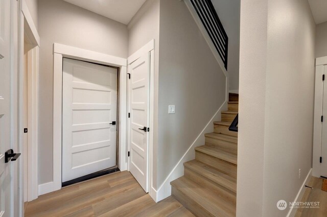 foyer entrance with light hardwood / wood-style flooring