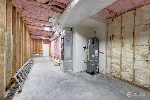 basement with heating unit and strapped water heater