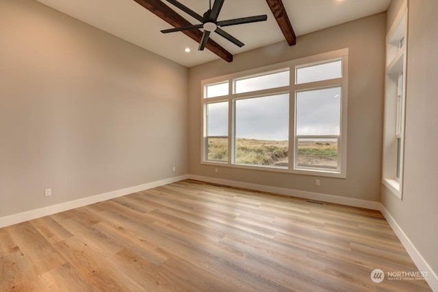 unfurnished room with lofted ceiling with beams, light hardwood / wood-style flooring, and ceiling fan