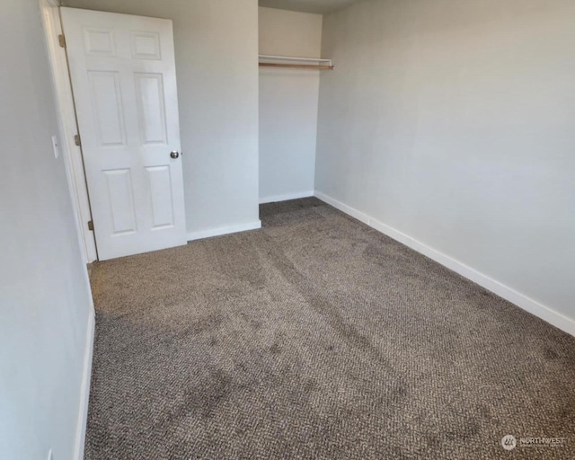 unfurnished room featuring carpet