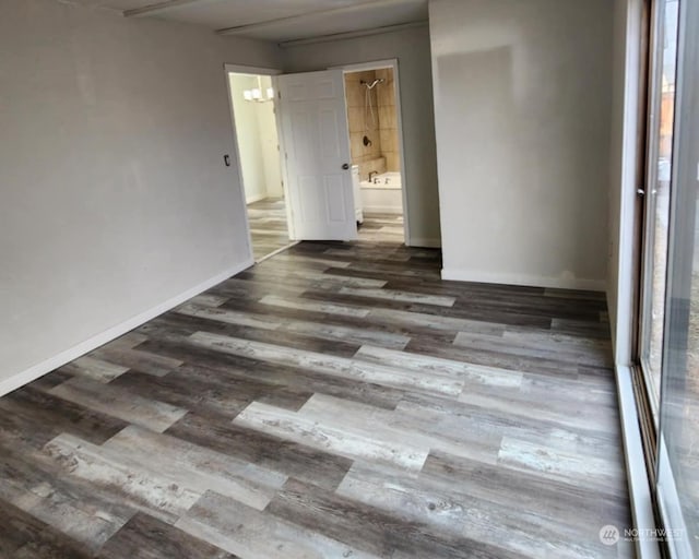 spare room with dark hardwood / wood-style floors