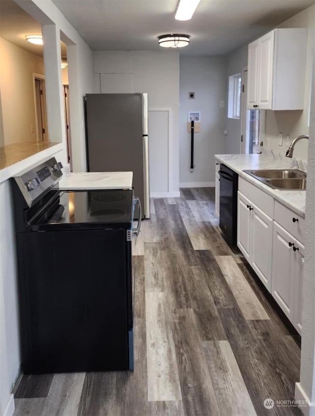 kitchen featuring white cabinets, sink, dark hardwood / wood-style floors, and black appliances