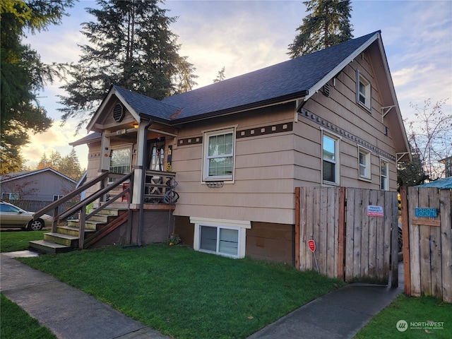 view of front of property with a lawn