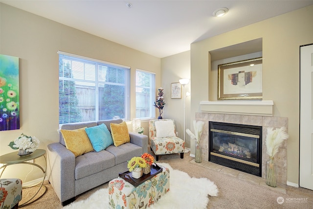 carpeted living room with a fireplace