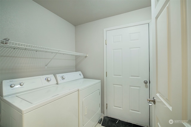 laundry area with independent washer and dryer