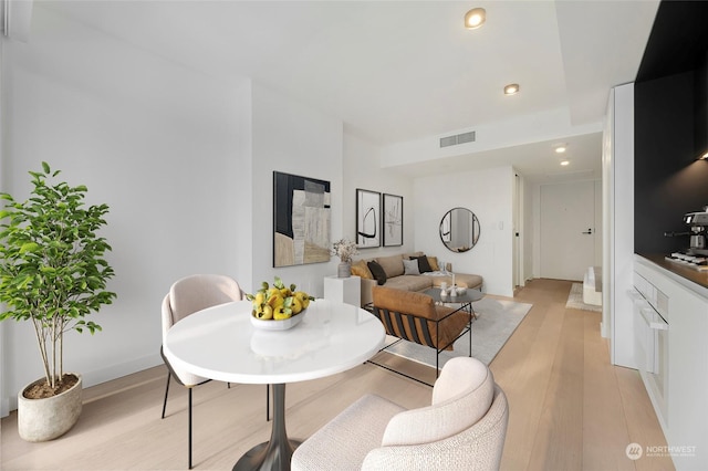 dining space featuring light wood-type flooring