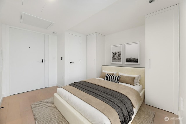 bedroom featuring light hardwood / wood-style flooring