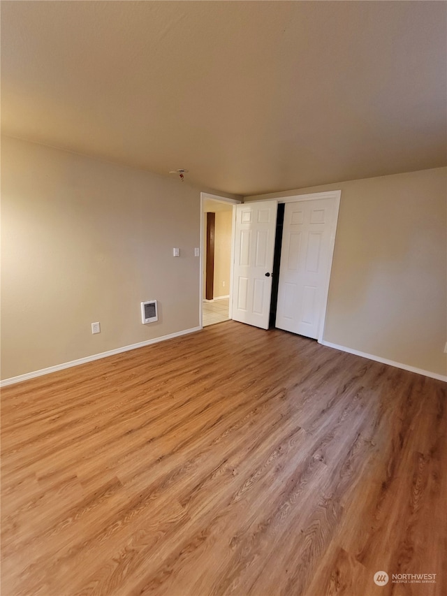 empty room featuring light hardwood / wood-style floors