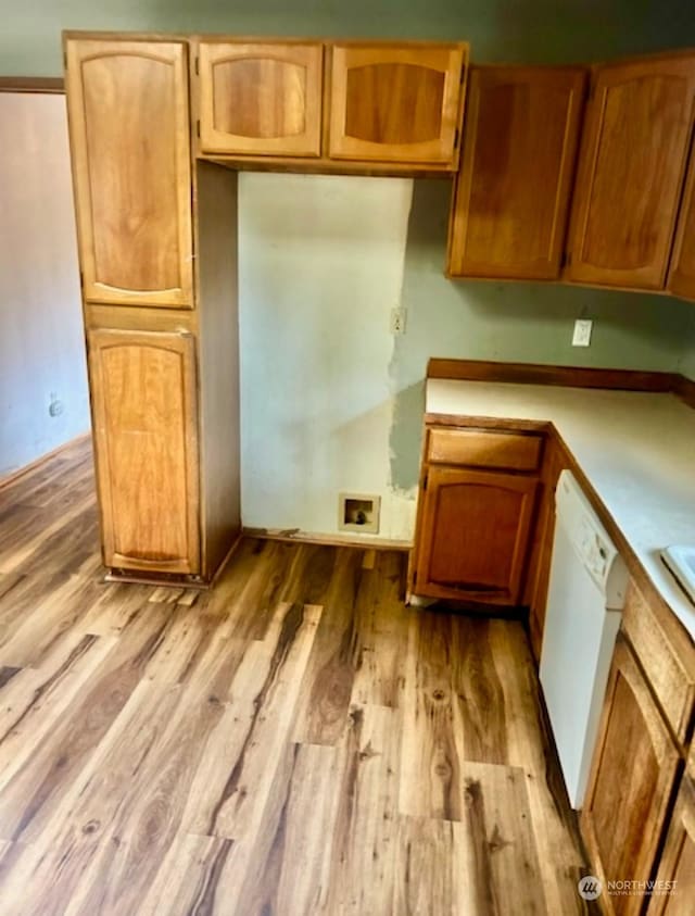 kitchen featuring white dishwasher and light wood-type flooring