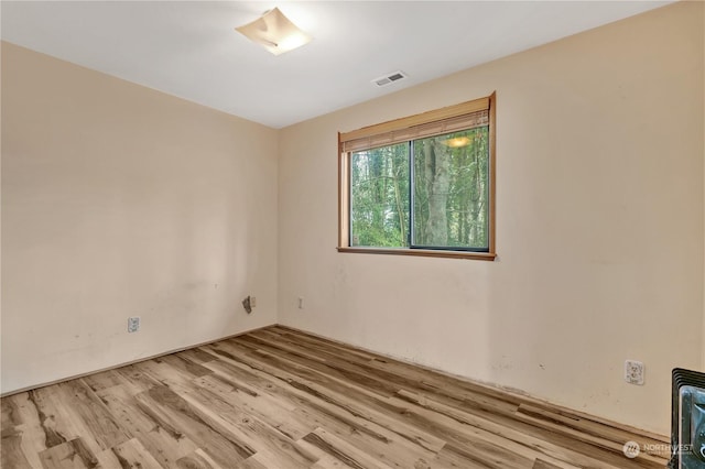 spare room with light wood-type flooring